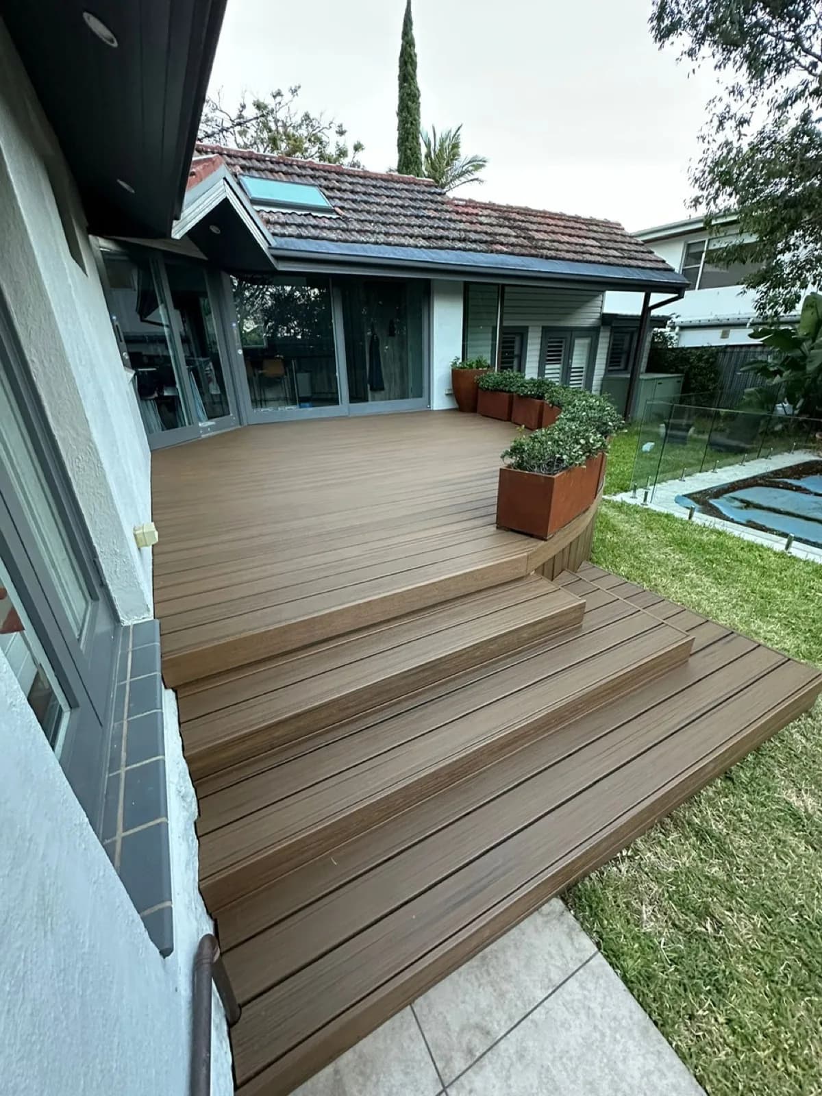 Wide composite stair treads from deck down to paved path