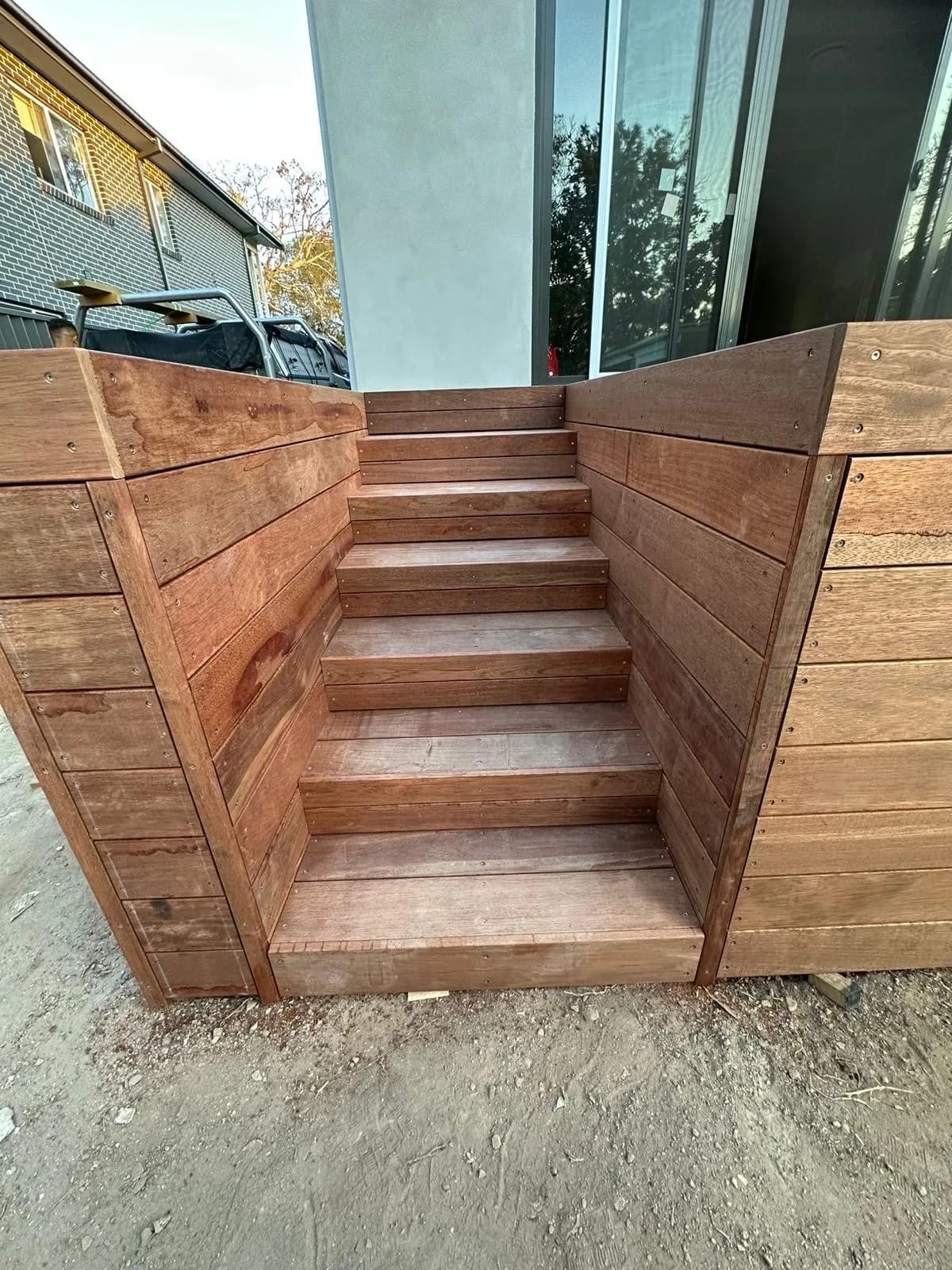 Boxed merbau stair close-up between clad walls