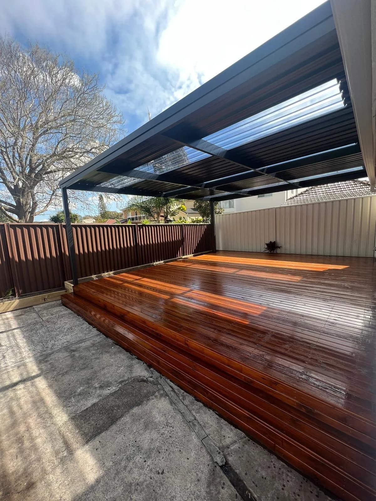 Same deck after merbau-colour stain, glossy finish